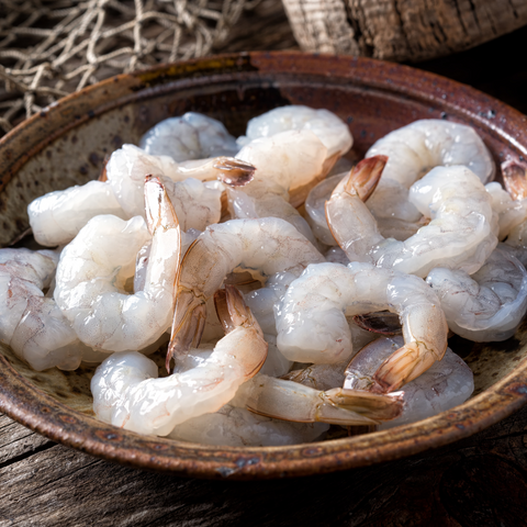 bowl of tail on raw shrimp 